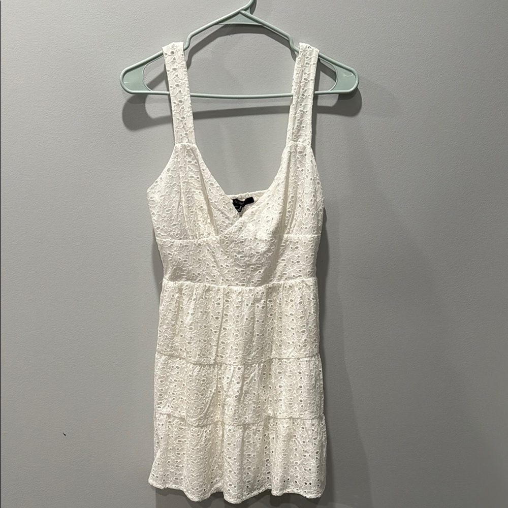 White Tiered Smocked Mini Dress with V-neck and Sleeveless Design
